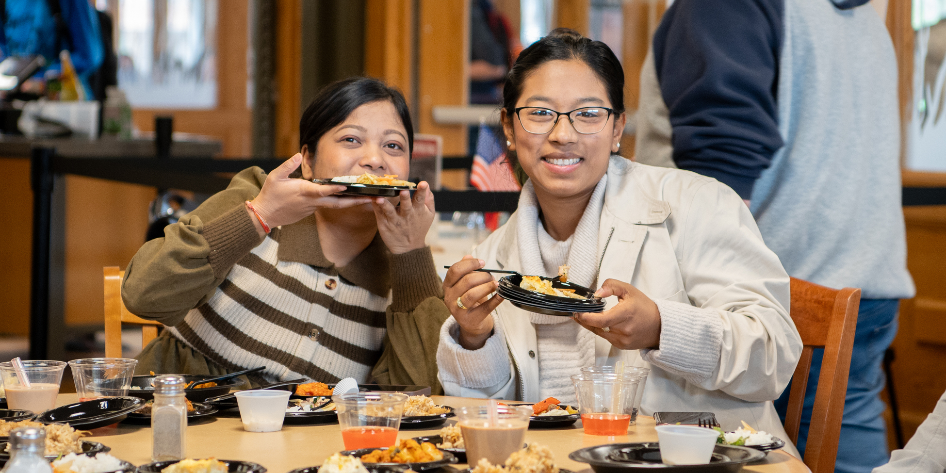 two students enjoying food